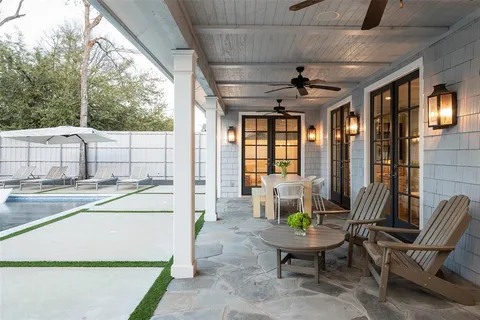 a balcony with furniture and a potted plant