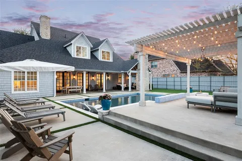 a view of house with a swimming pool outdoor seating and city view