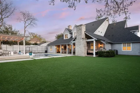 a front view of a house with a garden and porch