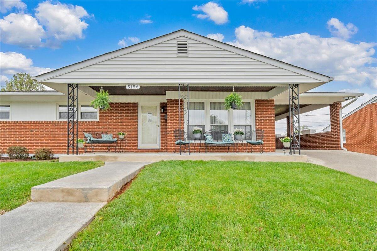 5156 Hazelridge Road Northwest Roanoke, VA 24012 - Photo 3 of 30 a view of a house with a garden and patio