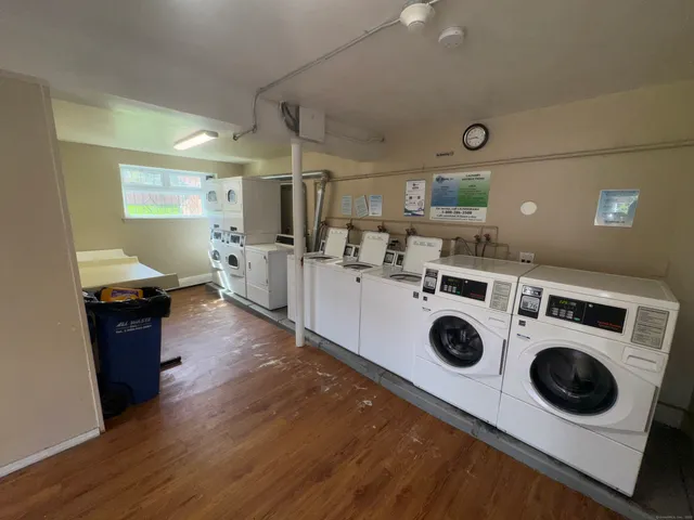 a kitchen with a stove a microwave and wooden floor