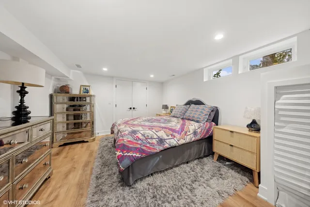 a view of a house with a big yard and large trees
