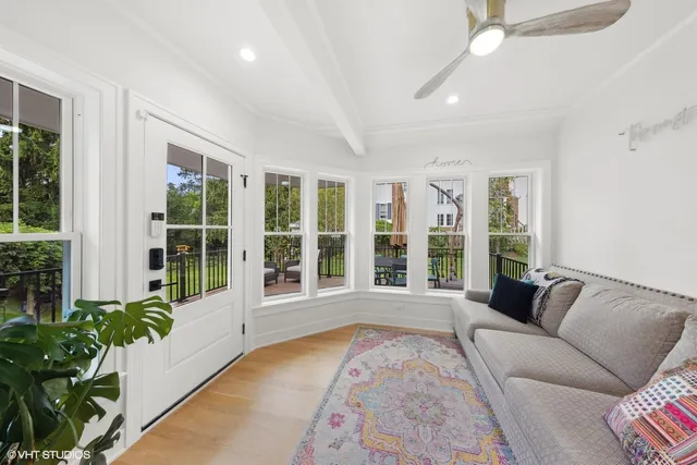 a view of a chair and tables in the balcony