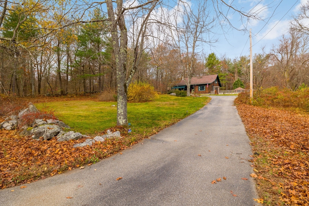 404 Rawson Street, Unit 404 Leicester, MA 01524 - Photo 2 of 13 a view of a garden with a tree