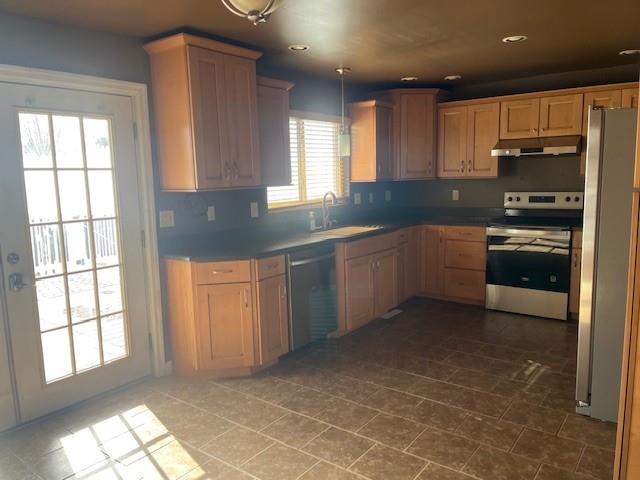 225 Larson Boulevard Rostraver Township, PA 15012 - Photo 2 of 15 a kitchen with stainless steel appliances granite countertop a stove a sink and a refrigerator