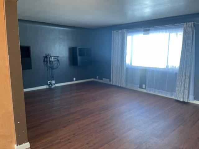 225 Larson Boulevard Rostraver Township, PA 15012 - Photo 6 of 15 an empty room with wooden floor and windows