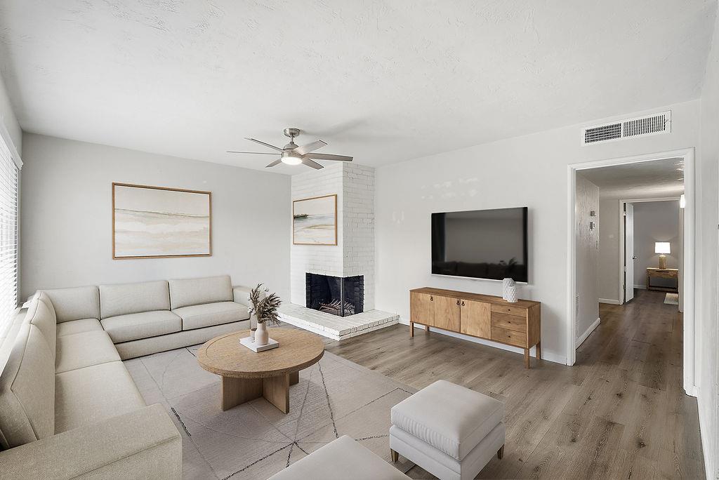 a living room with furniture and a flat screen tv