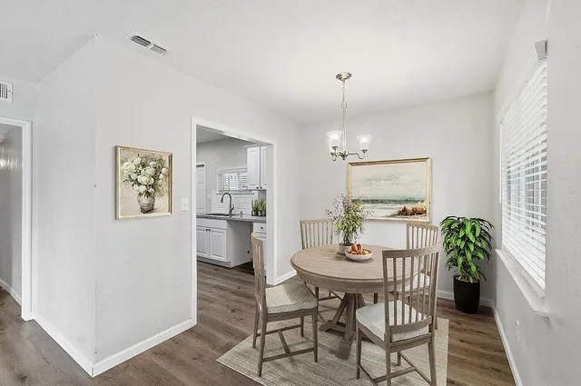 a dining room with furniture and window