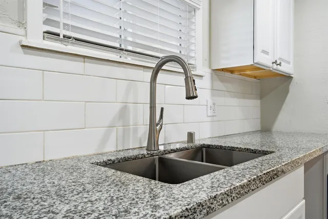a kitchen with a sink and a stove