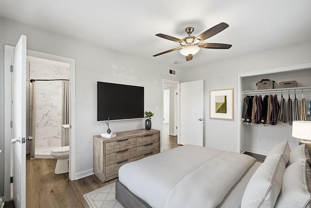 2999 East Richert Avenue Fresno, CA 93726 - Photo 6 of 19 a bedroom with a bed and a flat screen tv