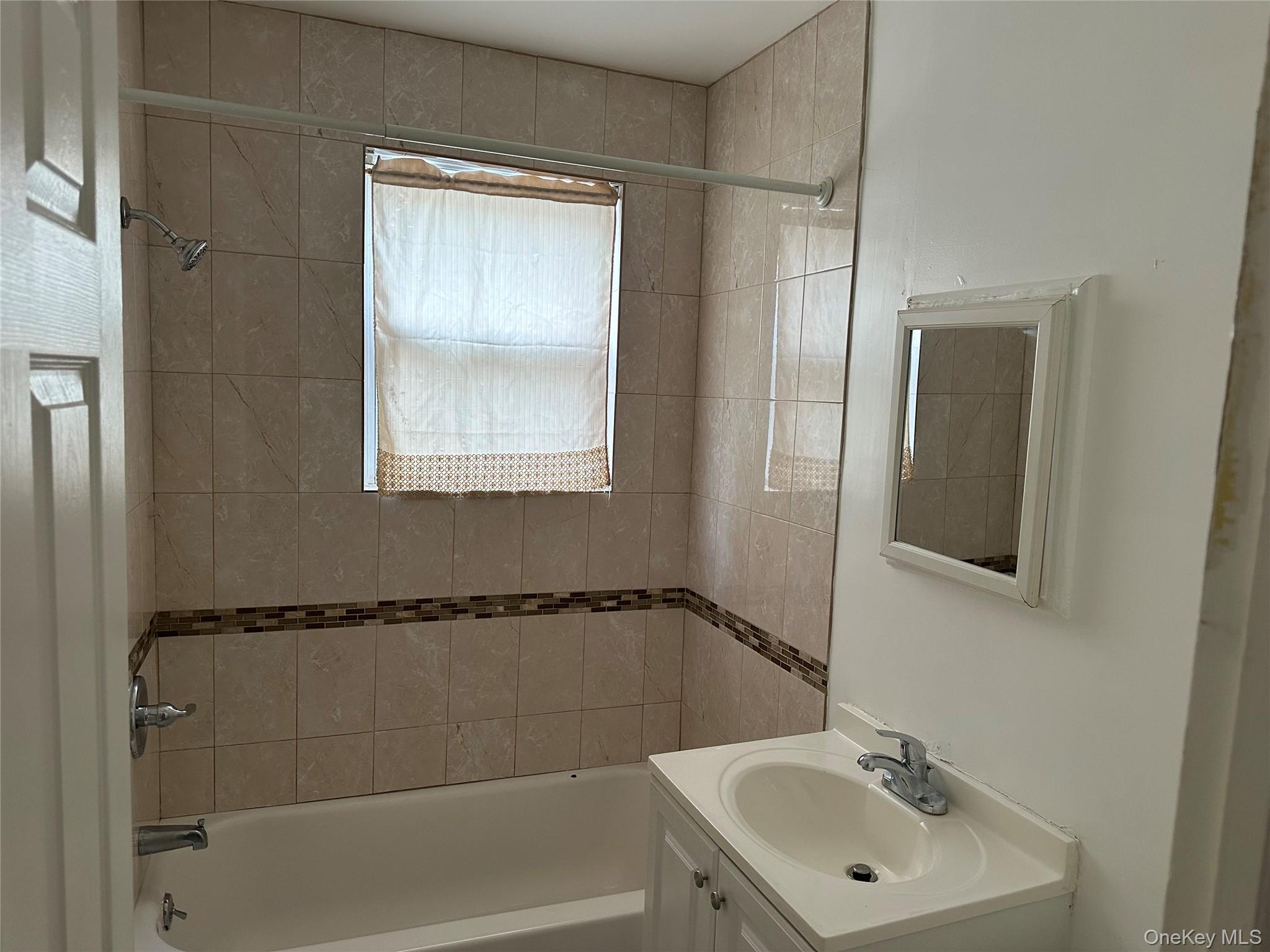 9 Webster Avenue, Unit 1 New Rochelle, NY 10801 - Photo 7 of 7 a bathroom with a sink toilet and shower
