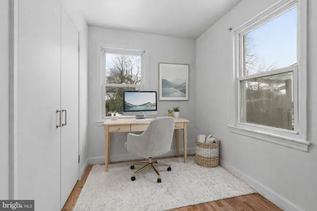 a workspace with furniture and window