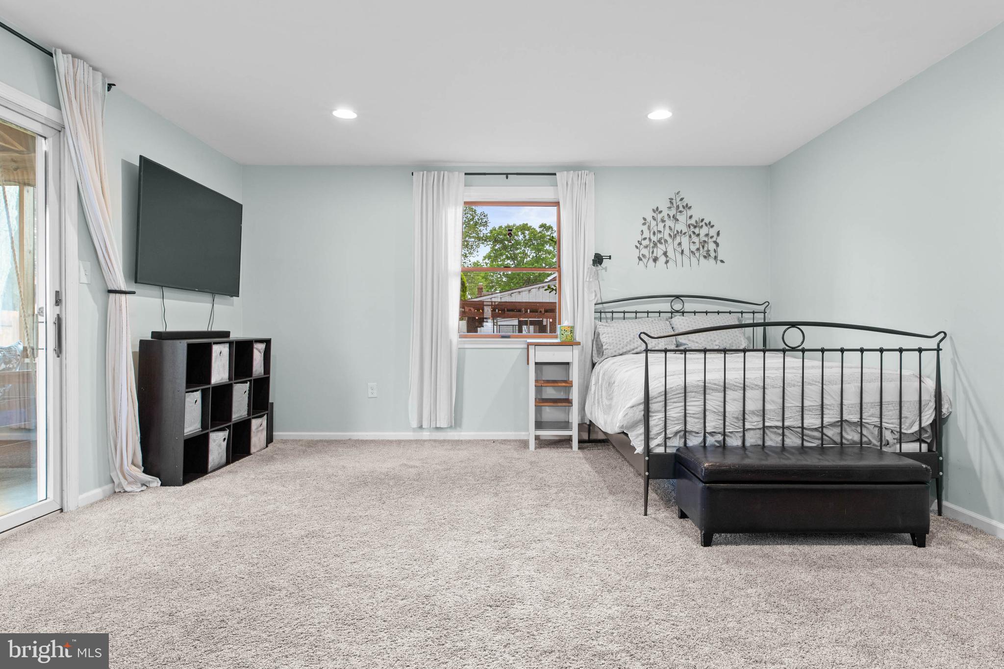 465 Briarhill Road Springfield, PA 19064 - Photo 16 of 51 a bedroom with a bed and a flat screen tv