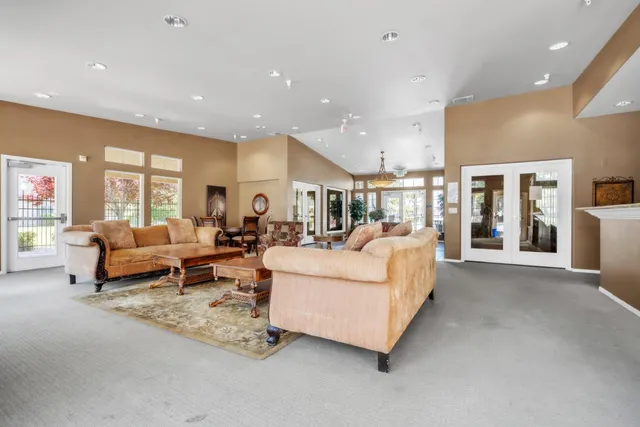 a living room with furniture and a table