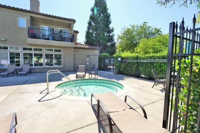 a house view with a seating space and a garden view