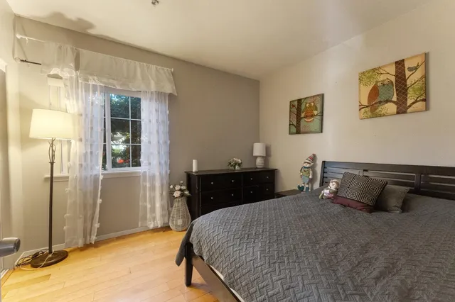 a bedroom with a bed and a table