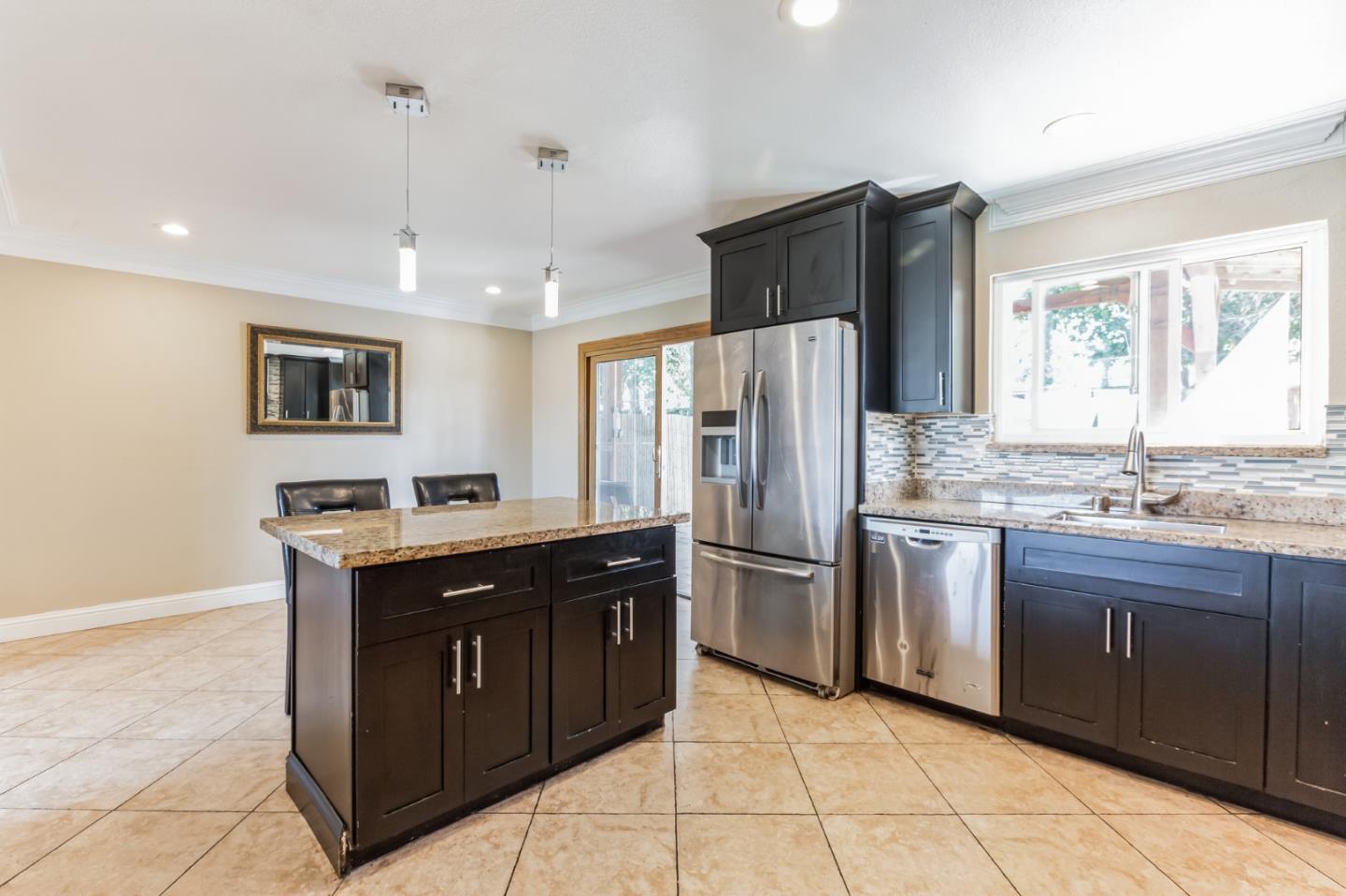 1430 Olympic Drive Milpitas, CA 95035 - Photo 11 of 21 a kitchen with stainless steel appliances granite countertop a refrigerator and a sink