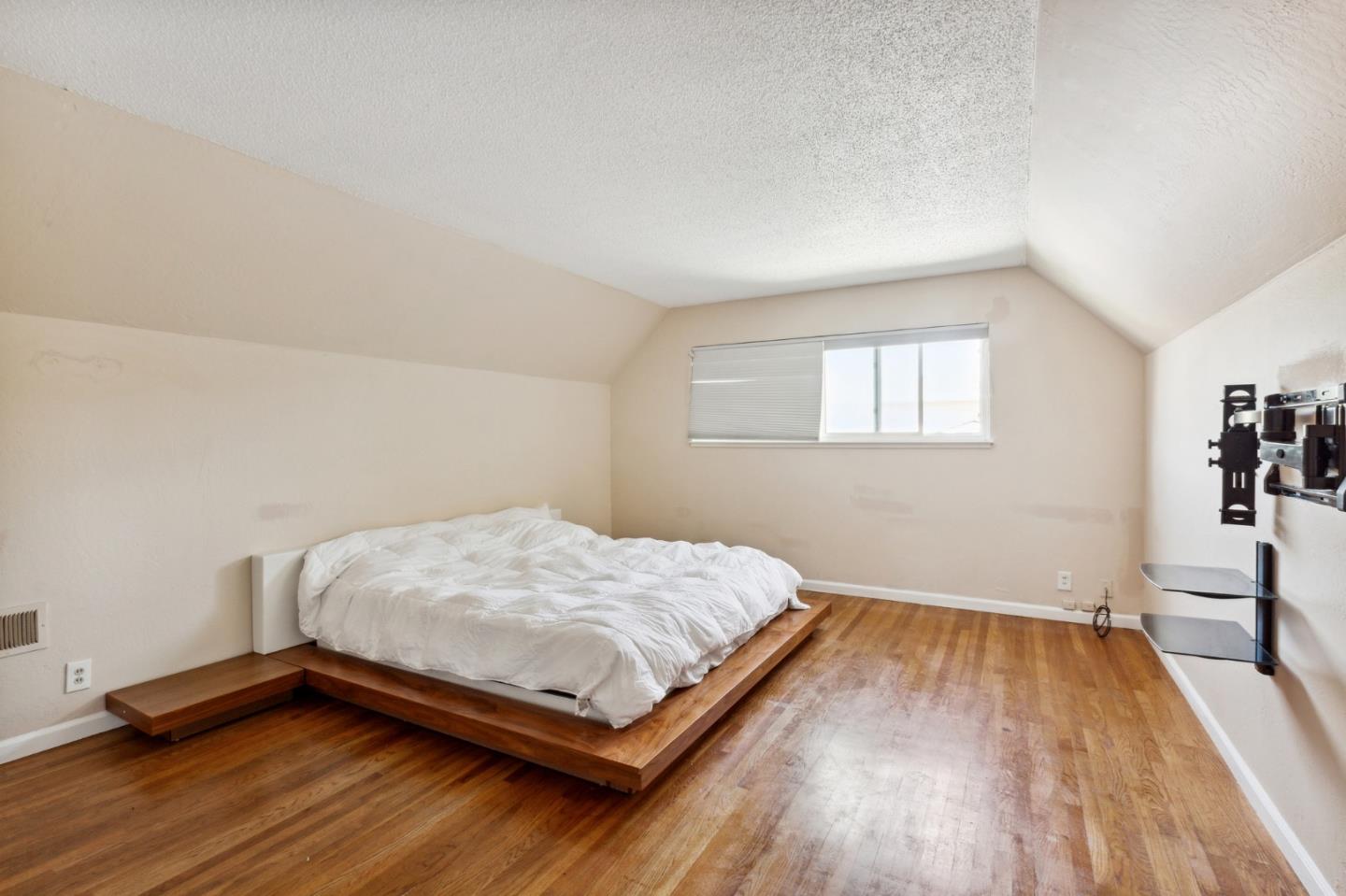 1430 Olympic Drive Milpitas, CA 95035 - Photo 12 of 21 a bedroom with a bed and a window