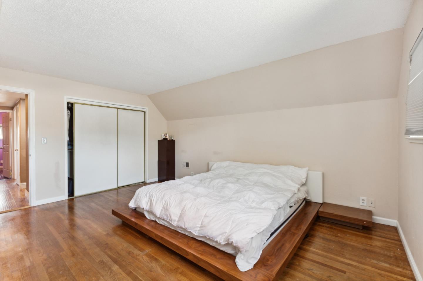 1430 Olympic Drive Milpitas, CA 95035 - Photo 13 of 21 a bedroom with a bed and wooden floor