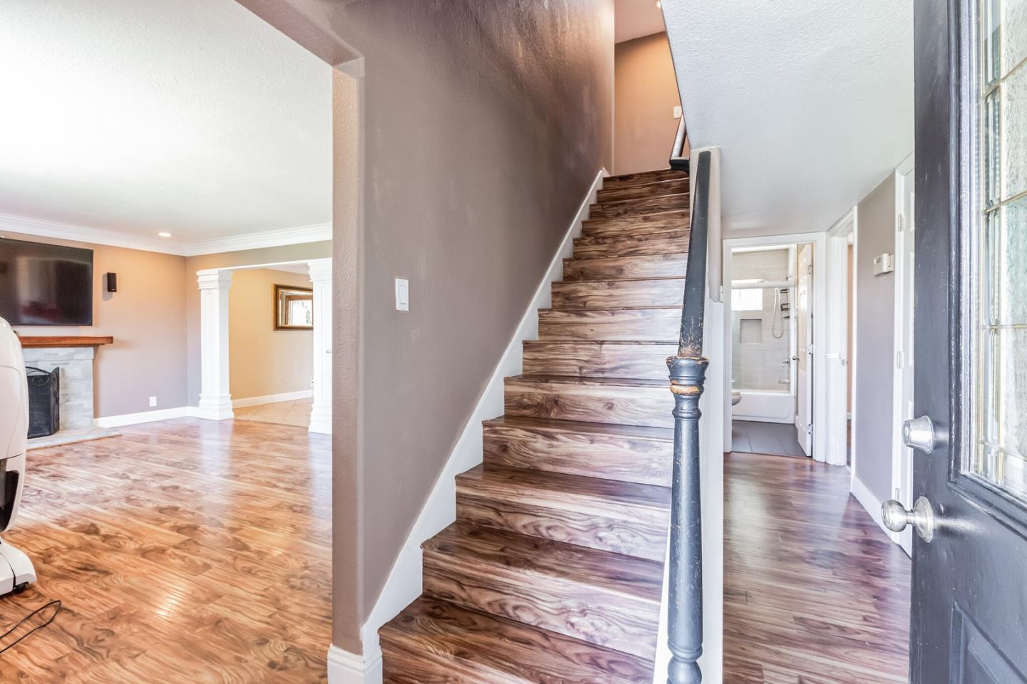 1430 Olympic Drive Milpitas, CA 95035 - Photo 16 of 21 a view of an entryway with wooden floor and a livingroom view