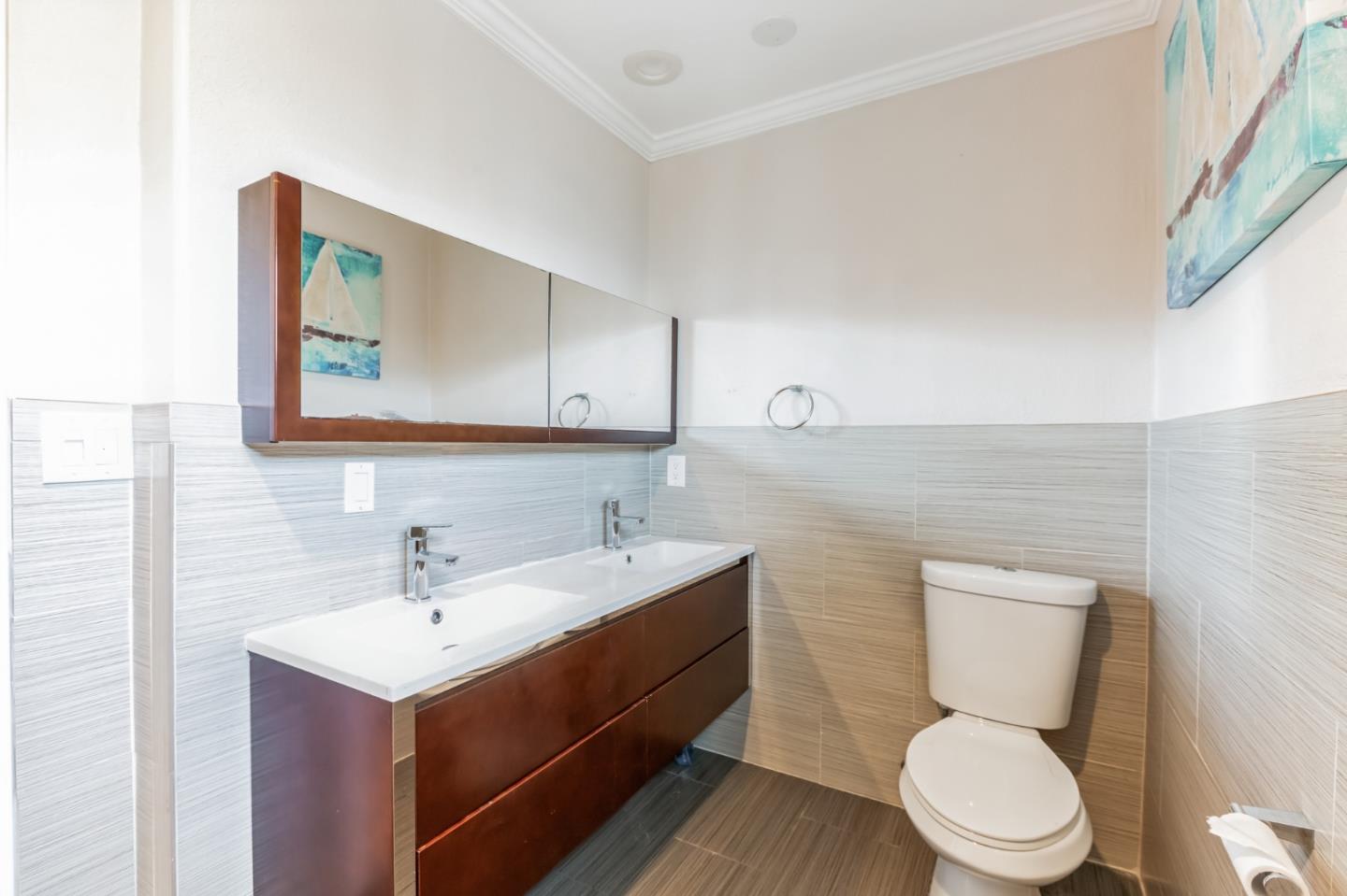 1430 Olympic Drive Milpitas, CA 95035 - Photo 17 of 21 a bathroom with a toilet a sink and mirror