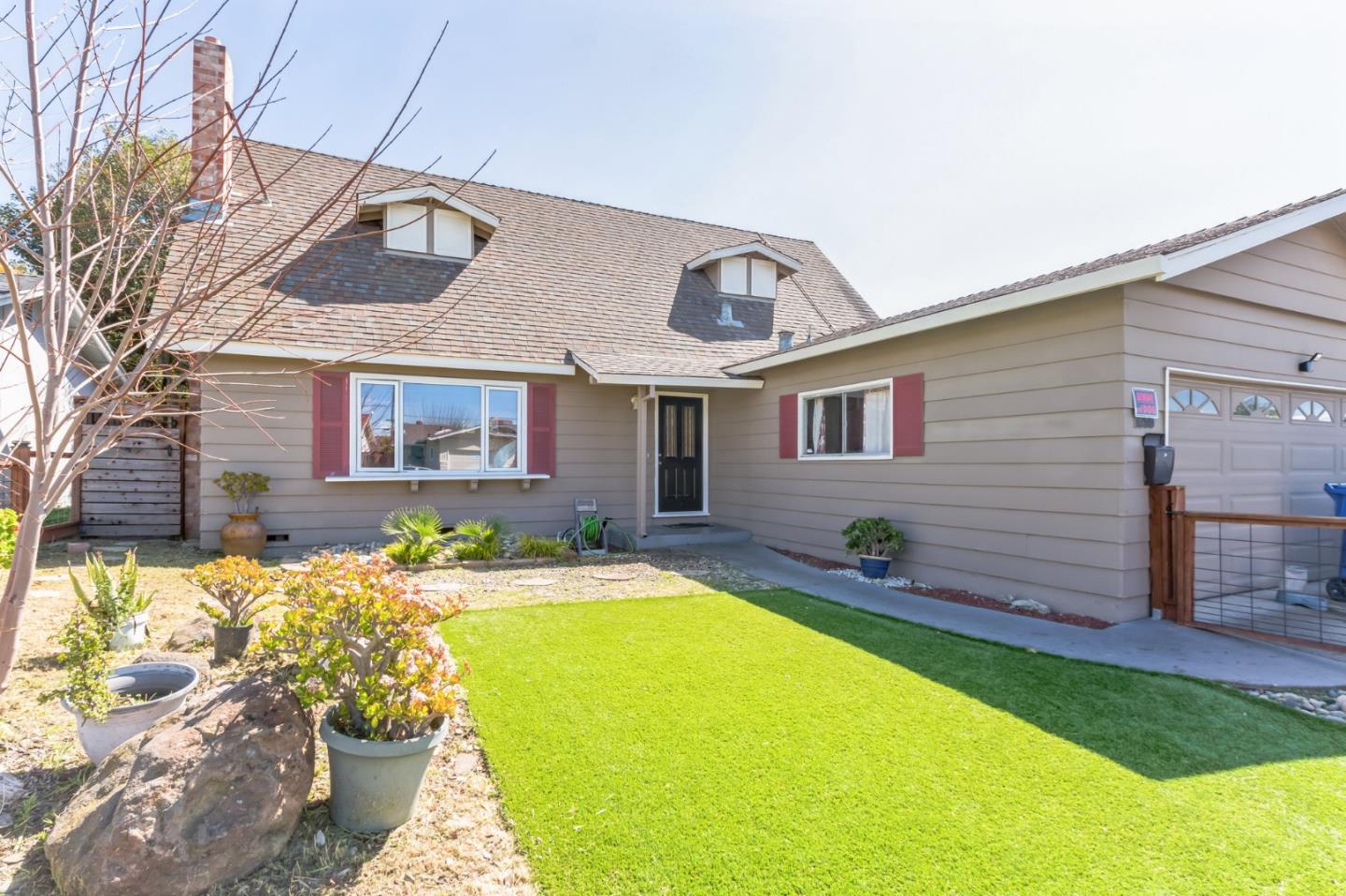 1430 Olympic Drive Milpitas, CA 95035 - Photo 2 of 21 a front view of a house with a yard