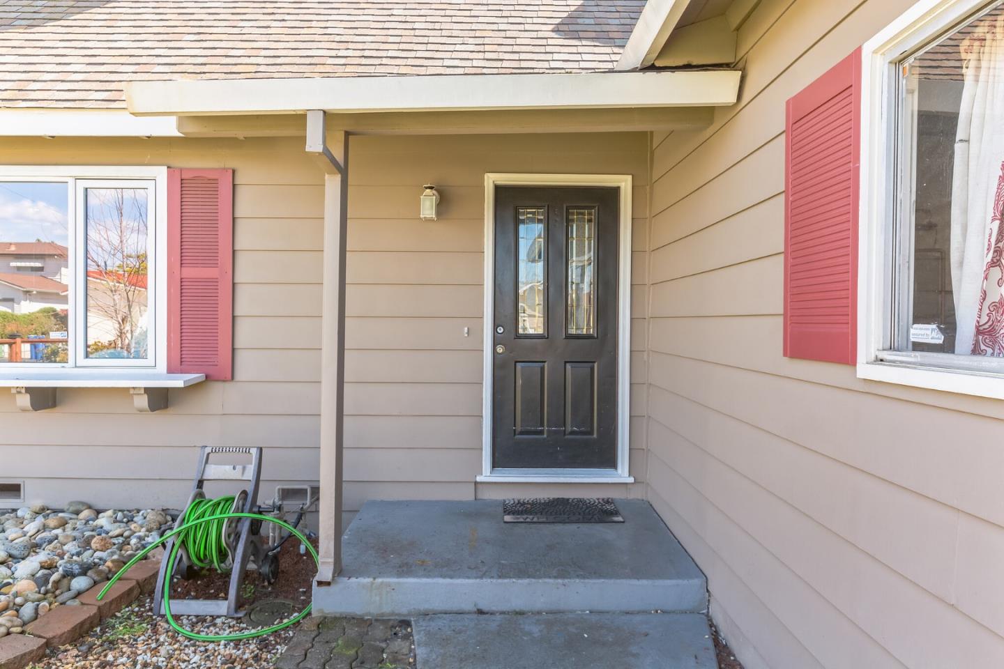 1430 Olympic Drive Milpitas, CA 95035 - Photo 3 of 21 a view of front door of house with potted plant