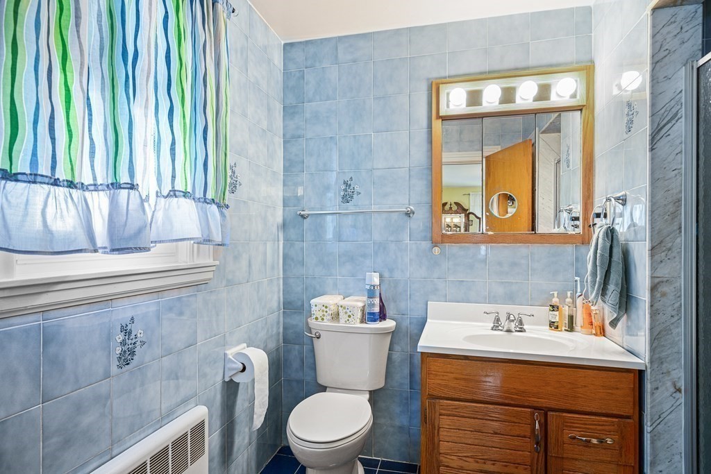 23 Webster Road Lexington, MA 02421 - Photo 13 of 32 a bathroom with a toilet sink and mirror
