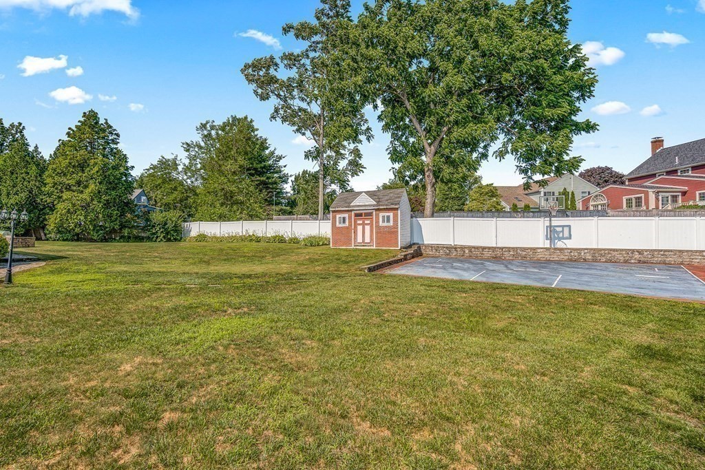 23 Webster Road Lexington, MA 02421 - Photo 29 of 32 a swimming pool with outdoor seating and yard