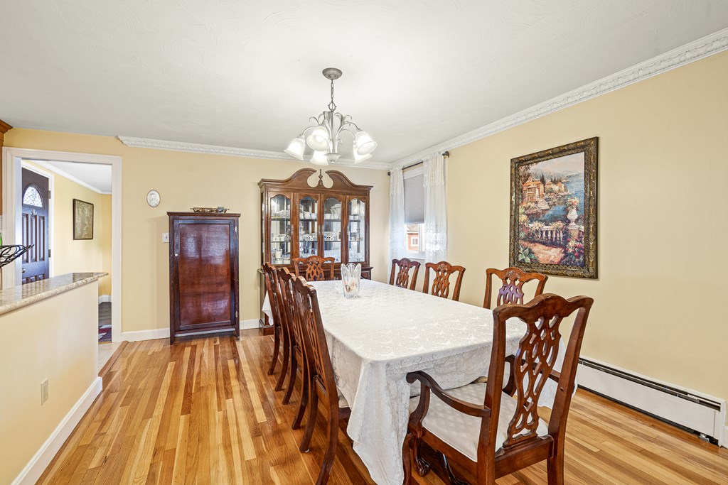 23 Webster Road Lexington, MA 02421 - Photo 4 of 32 a view of a dining room with furniture a chandelier and wooden floor