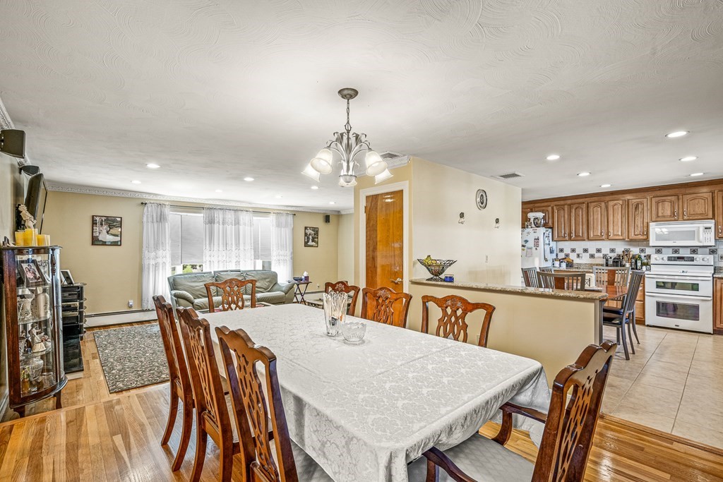 23 Webster Road Lexington, MA 02421 - Photo 6 of 32 a view of a a dining room with furniture window and wooden floor