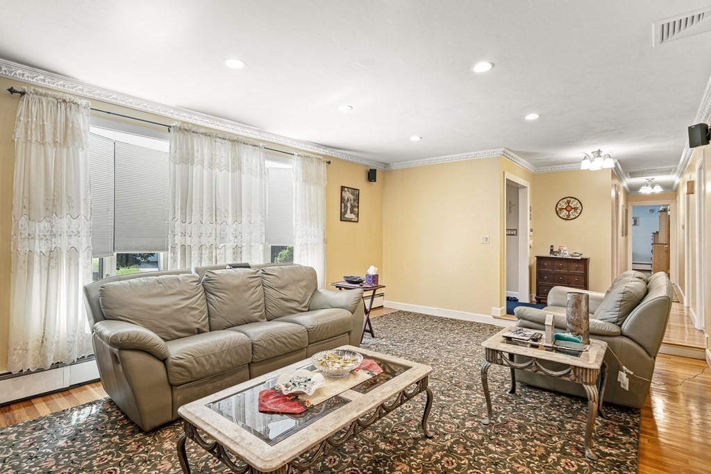 23 Webster Road Lexington, MA 02421 - Photo 8 of 32 a living room with furniture and a couch