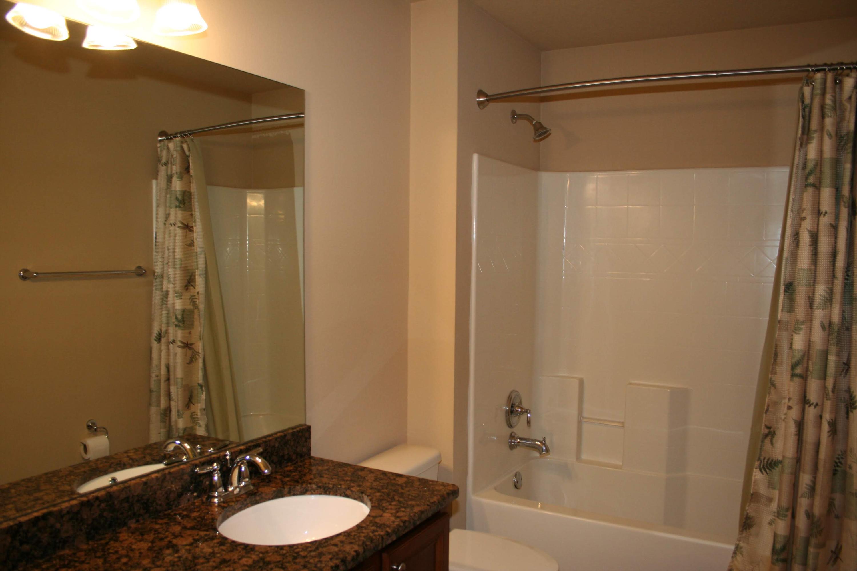 652 Red Fern Road Crestview, FL 32536 - Photo 18 of 32 a bathroom with a sink and a mirror