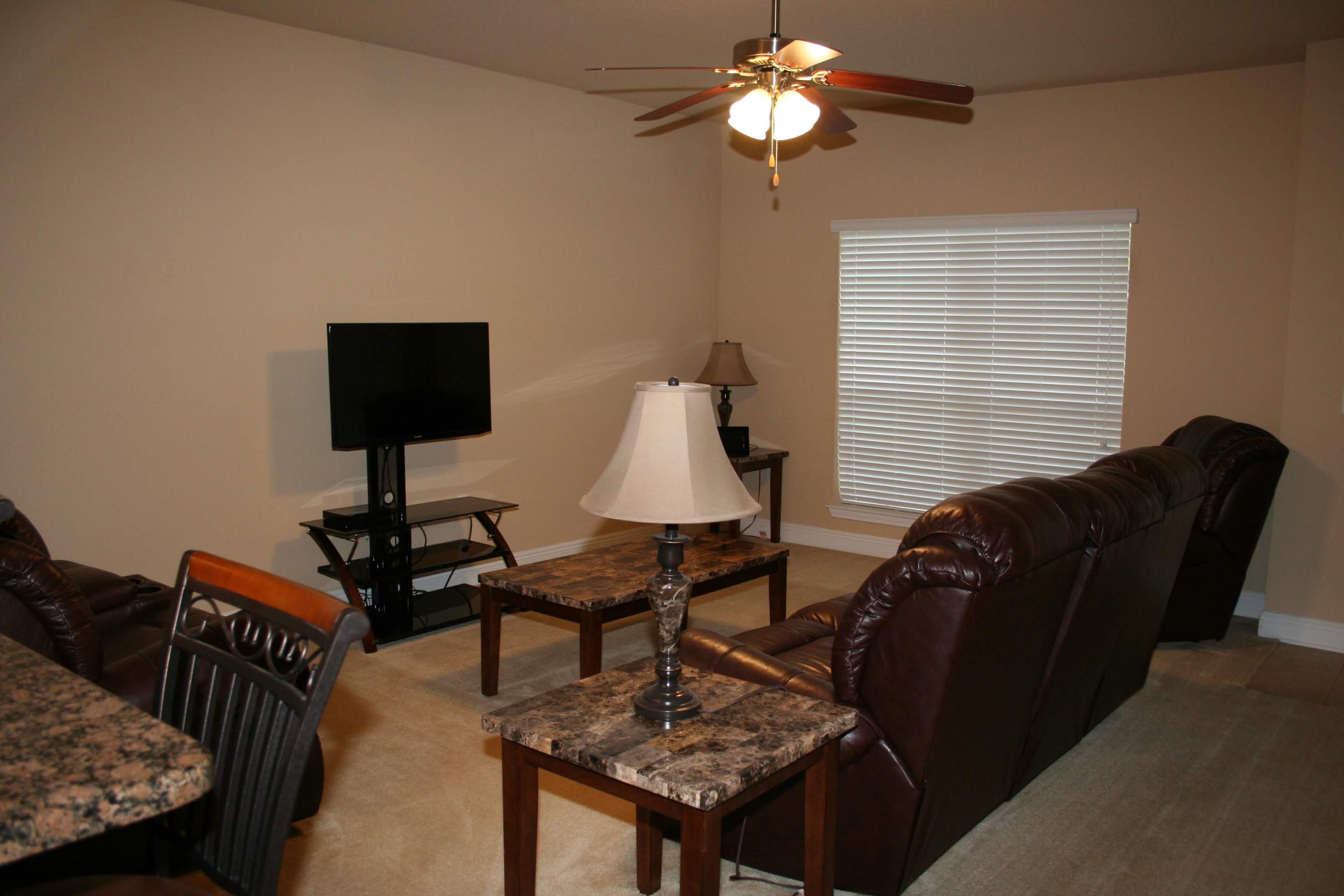 652 Red Fern Road Crestview, FL 32536 - Photo 3 of 32 a living room with furniture a rug and a window
