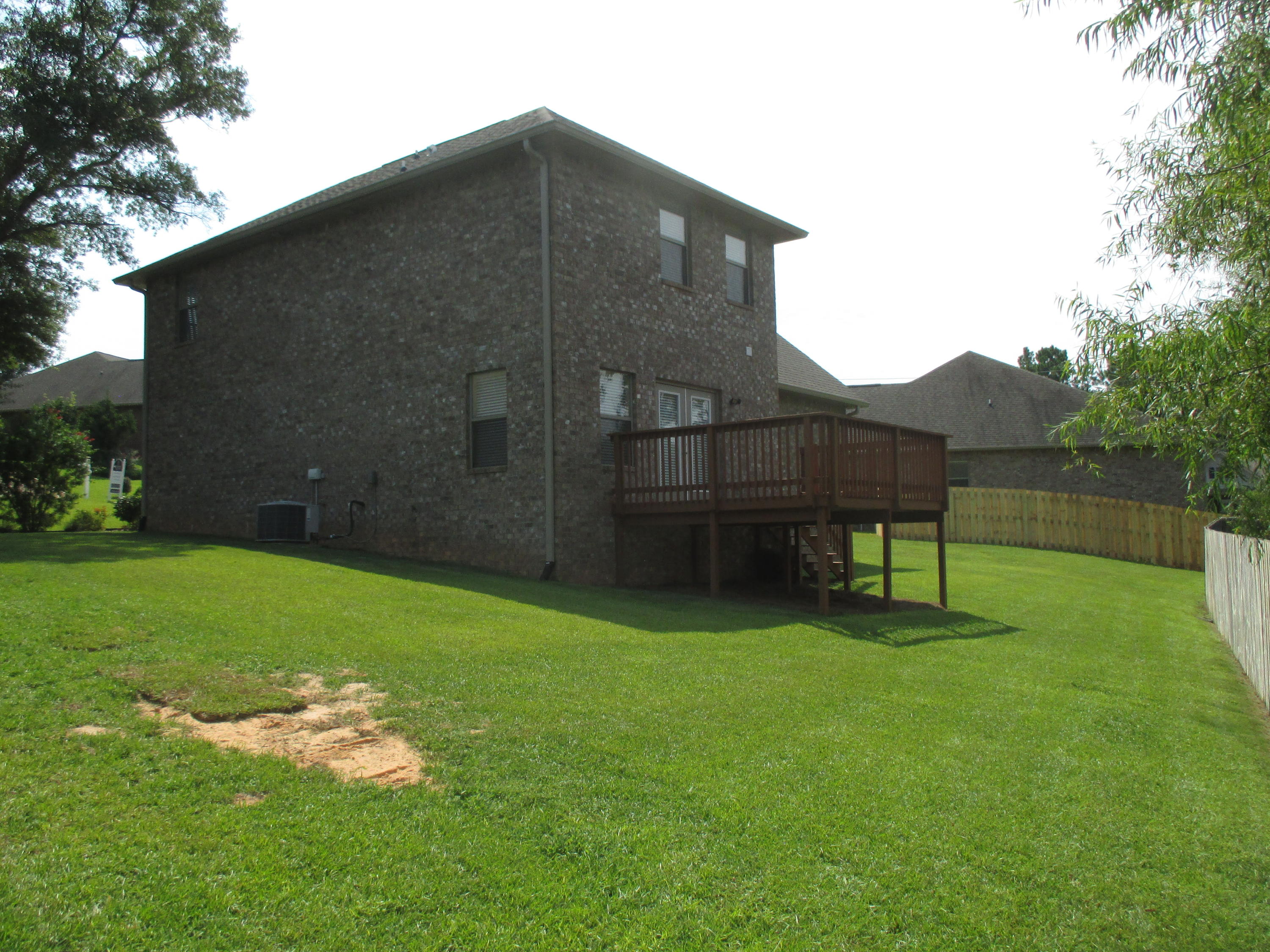652 Red Fern Road Crestview, FL 32536 - Photo 31 of 32 a backyard of a house with lots of green space