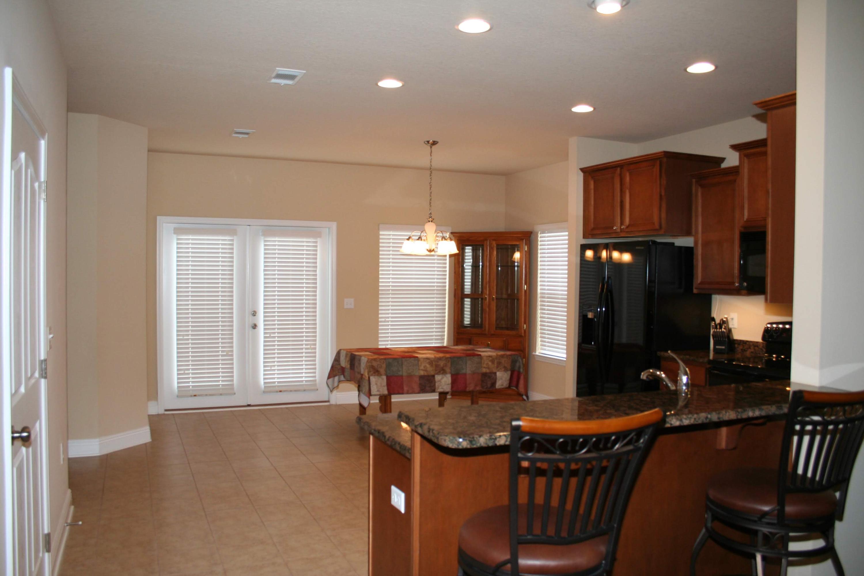 652 Red Fern Road Crestview, FL 32536 - Photo 6 of 32 a kitchen with stainless steel appliances granite countertop a sink a stove and a refrigerator