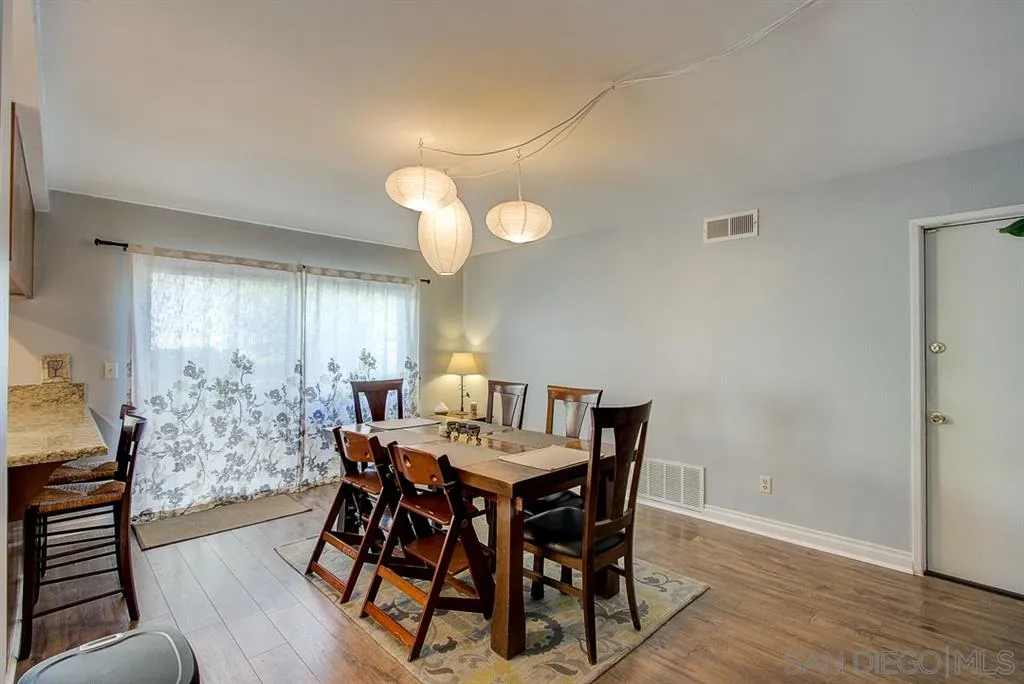 3577 Ridge Road Oceanside, CA 92056 - Photo 5 of 22 a view of a dining room with furniture and wooden floor