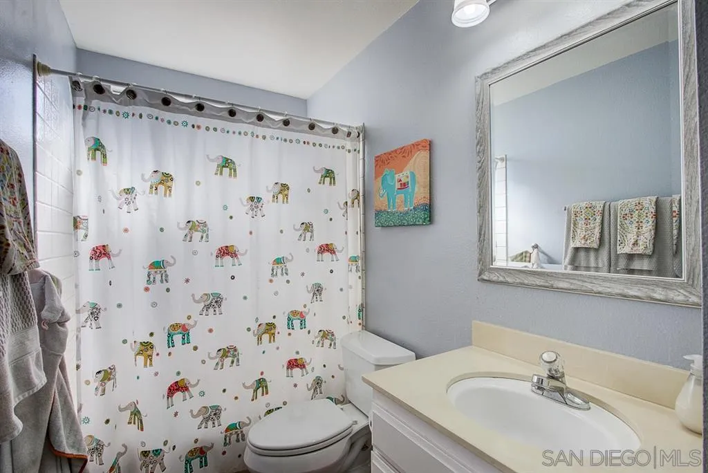 3577 Ridge Road Oceanside, CA 92056 - Photo 8 of 22 a bathroom with a sink toilet and shower