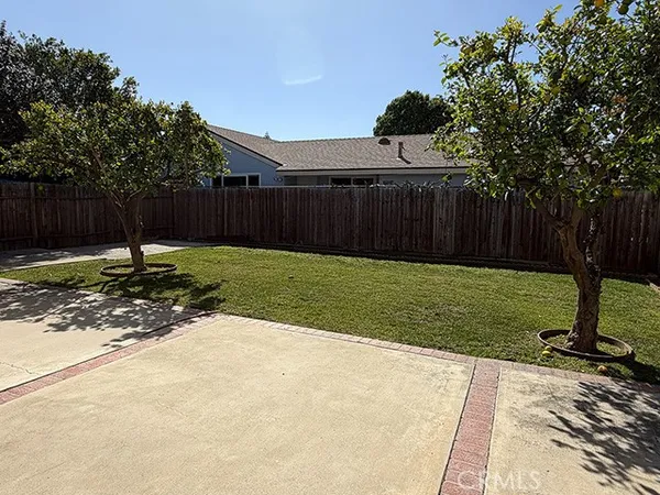 a backyard of a house with trampoline