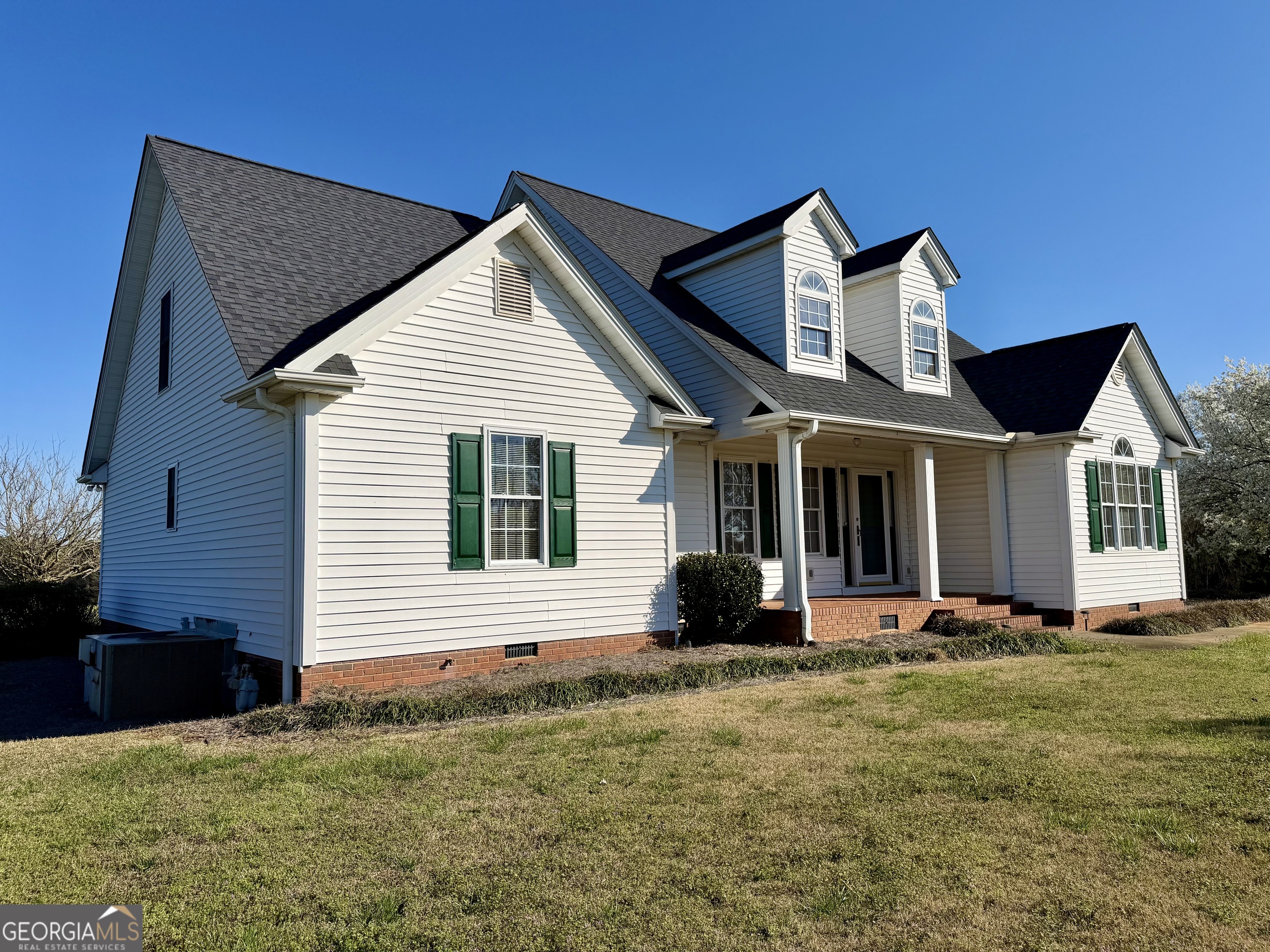 494 Broad Street Bowman, GA 30624 - Photo 13 of 65 a front view of a house with a yard