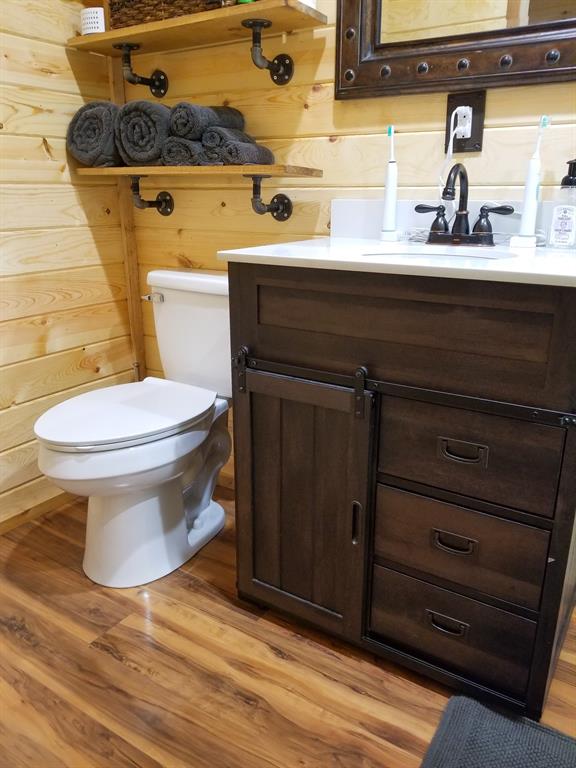 350 Summerfield Court Springtown, TX 76082 - Photo 10 of 20 a bathroom with a sink and a toilet