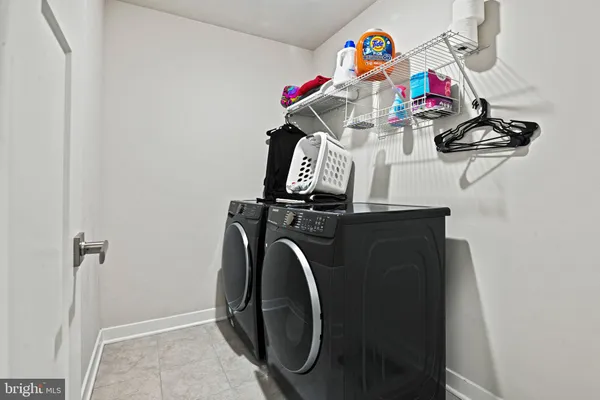 a bathroom with a shower a toilet and sink