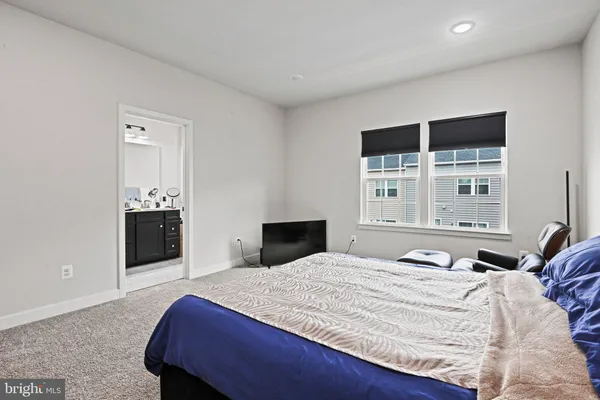 a bedroom with a bed and a walk in closet