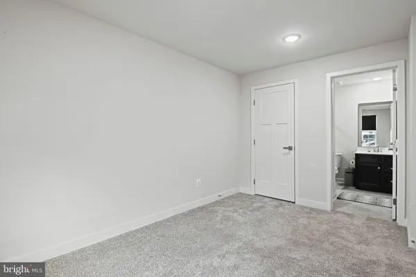 an empty room with a bathroom