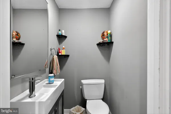 a bathroom with a toilet and a sink