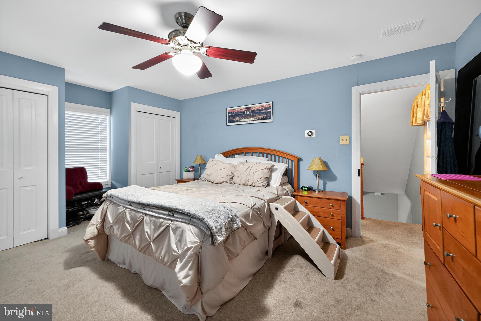 526 East Main Street Moorestown, NJ 08057 - Photo 20 of 49 a spacious bedroom with a bed and a chandelier