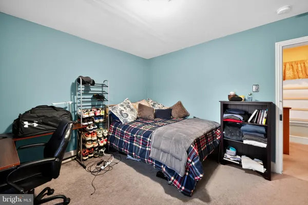 a bedroom with a bed and a tv