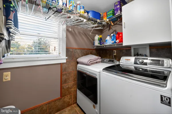 a utility room with washer and dryer