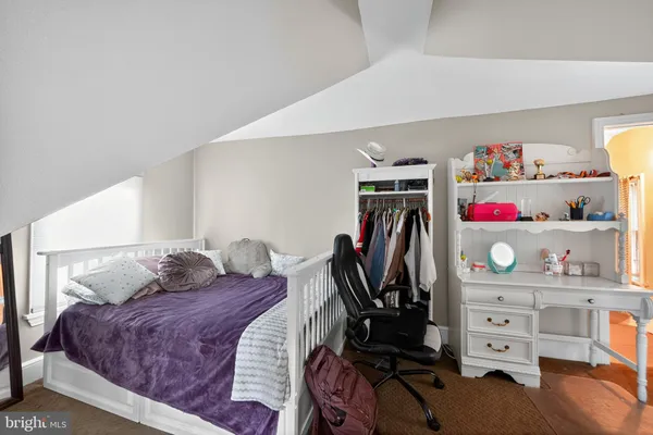 a bedroom with a bed and a closet