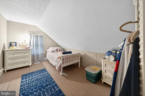 a bedroom with a bed and furniture